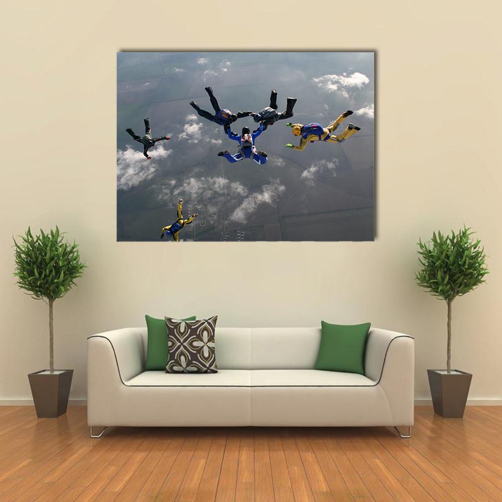 Skydivers in Formation Canvas Wall Art in white, gray and blue, single panel hung on a wall