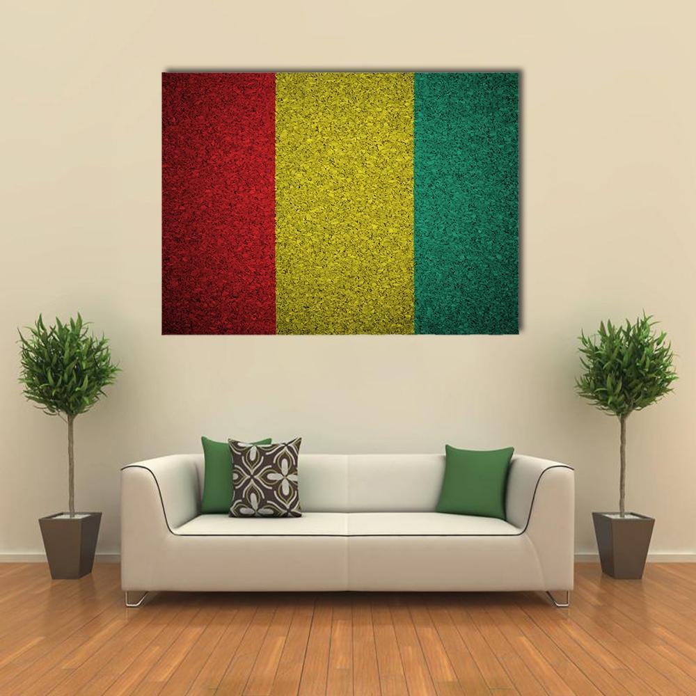 Guinean Flag Canvas Wall Art in red, yellow and green, single panel hung on a wall