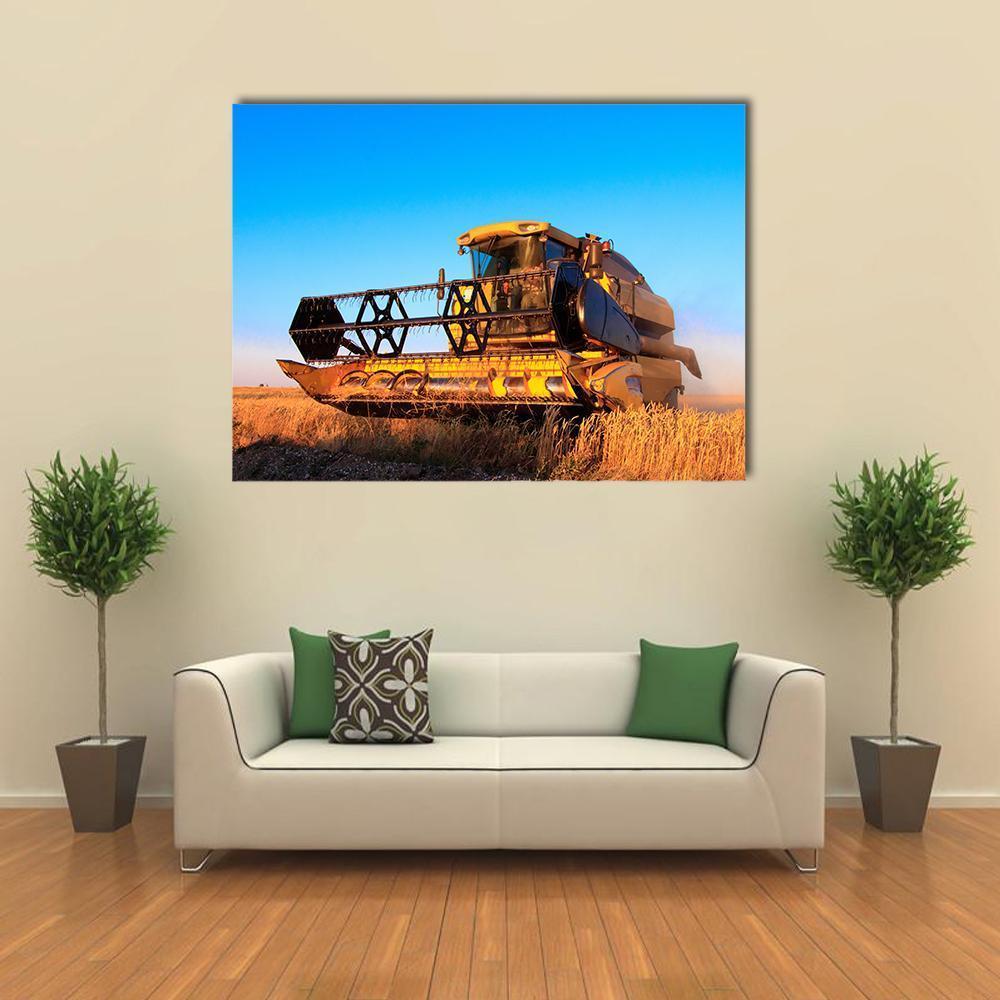 Combine Harvester in Wheat Field Canvas Wall Art in gold, yellow and blue, single panel hung on a wall