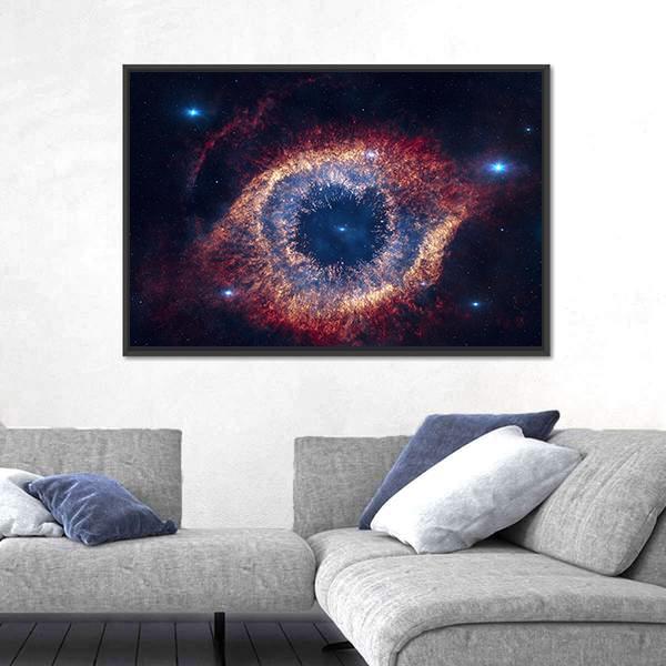 The Helix Nebula Eye of God Canvas Wall Art in black, red and blue, framed canvas, product view on a white background