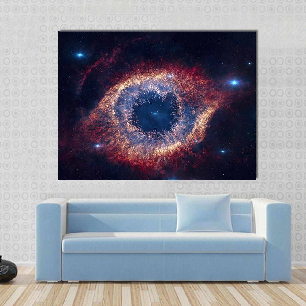 The Helix Nebula Eye of God Canvas Wall Art in black, red and blue, single panel hung on a wall