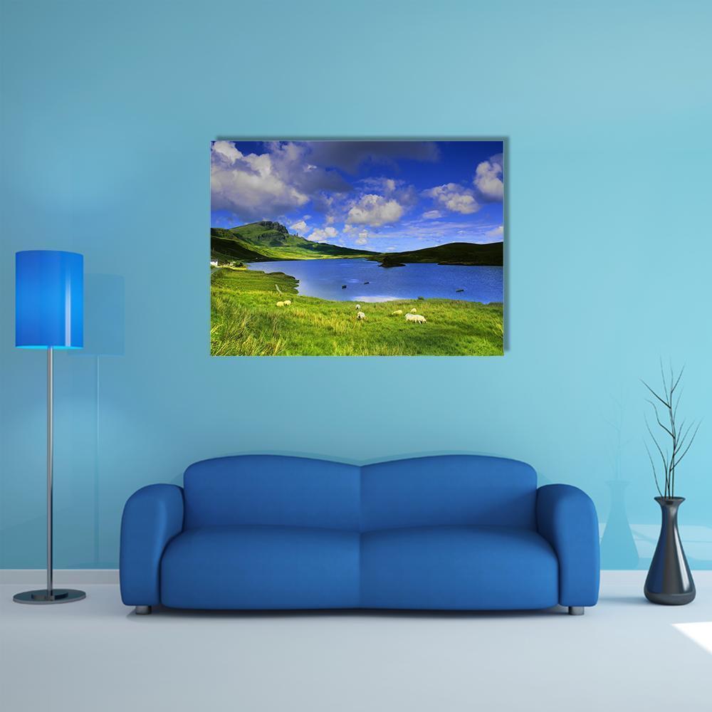 Isle of Skye Lake with Grazing Sheep Canvas Wall Art in white, green and blue, single panel hung on a wall