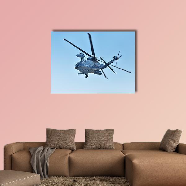 Uh-60j Helicopter in Flight Canvas Wall Art in black, gray and blue, single panel hung on a wall