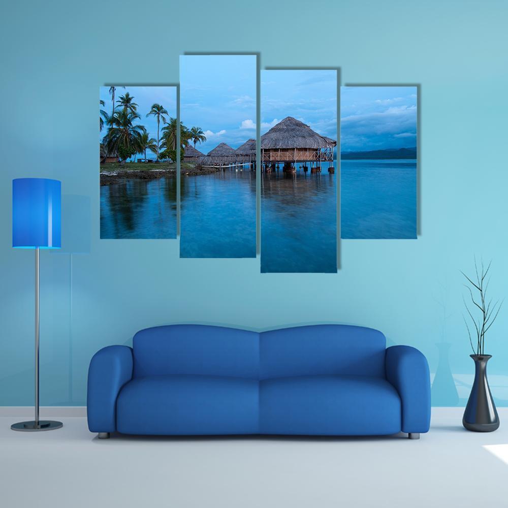 Huts In Blue Water Canvas Wall Art-4 Pop-Gallery Wrap-50" x 32"-Tiaracle