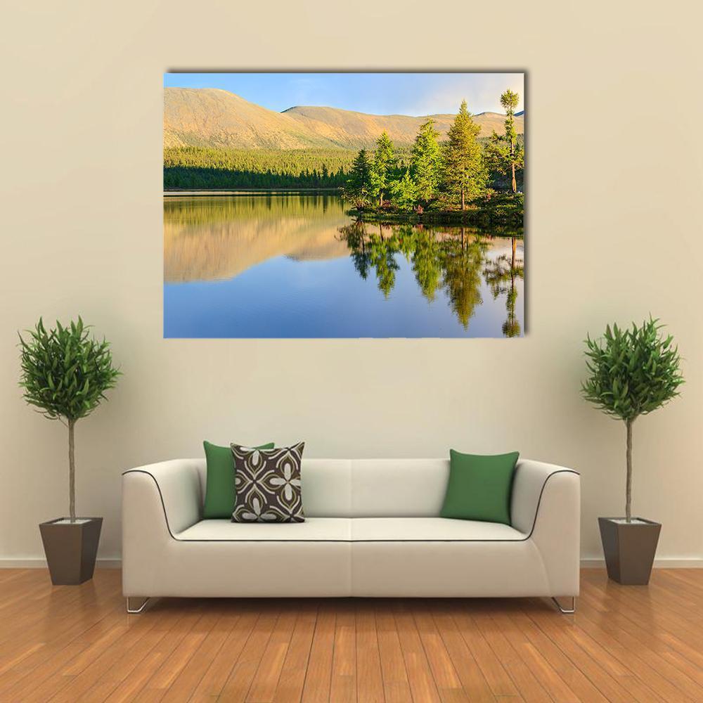 Sunlit Mountain Lake Canvas Wall Art in yellow, green and blue, single panel hung on a wall