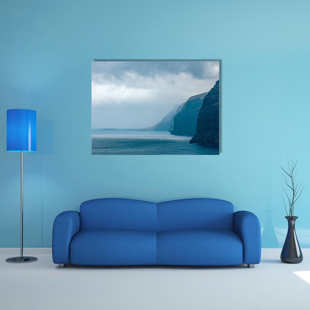 Cloudy Cliffs of Los Gigantes Canvas Wall Art in gray and blue, single panel hung on a wall