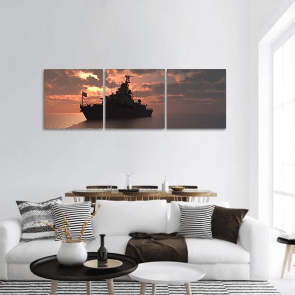 Naval Ship Silhouette at Sunset Panoramic Canvas Wall Art in black, gray and orange, hung on a wall