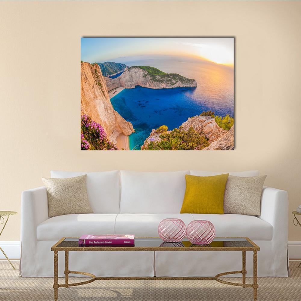 Navagio Beach Shipwreck at Sunset Canvas Wall Art in beige, orange and blue, single panel hung on a wall