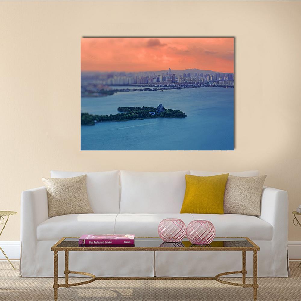 Jinji Lake Night Skyline Canvas Wall Art in orange, blue and pink, single panel hung on a wall
