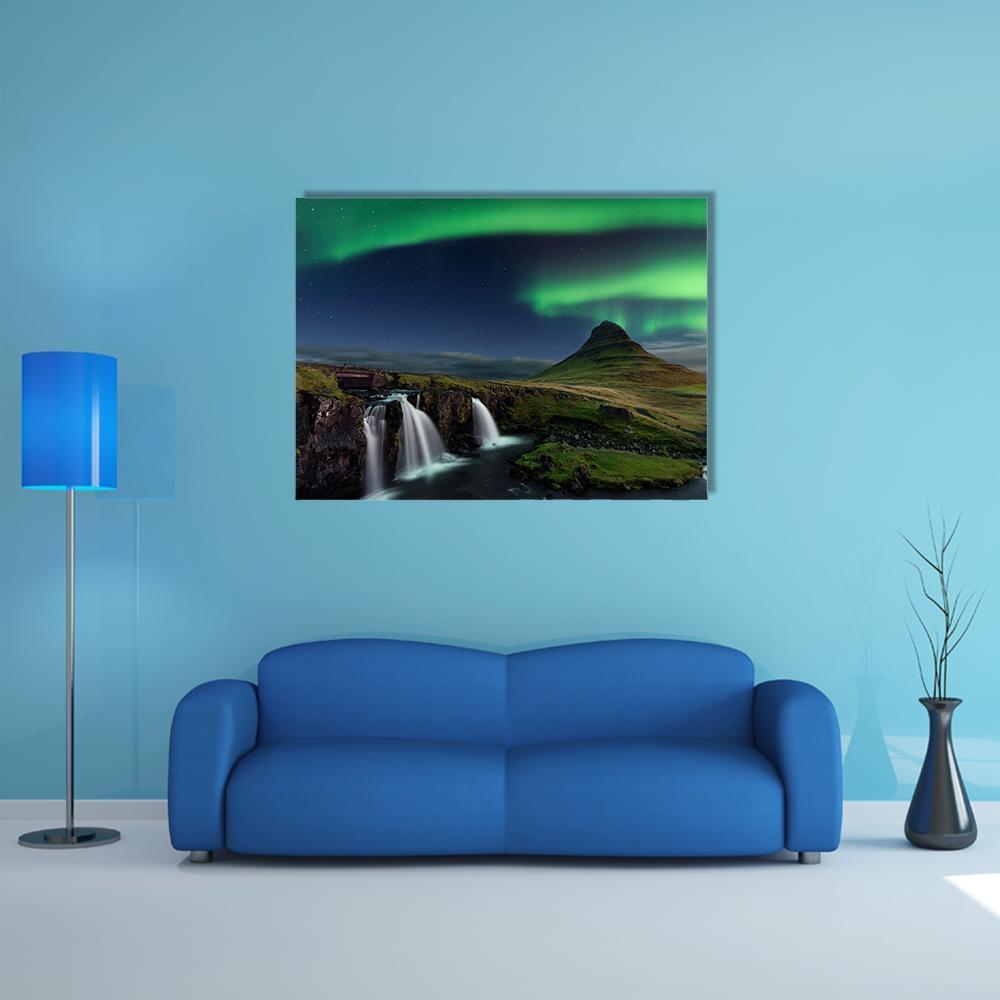 Aurora Over Cone-shaped Mountain Canvas Wall Art in black, green and blue, single panel hung on a wall