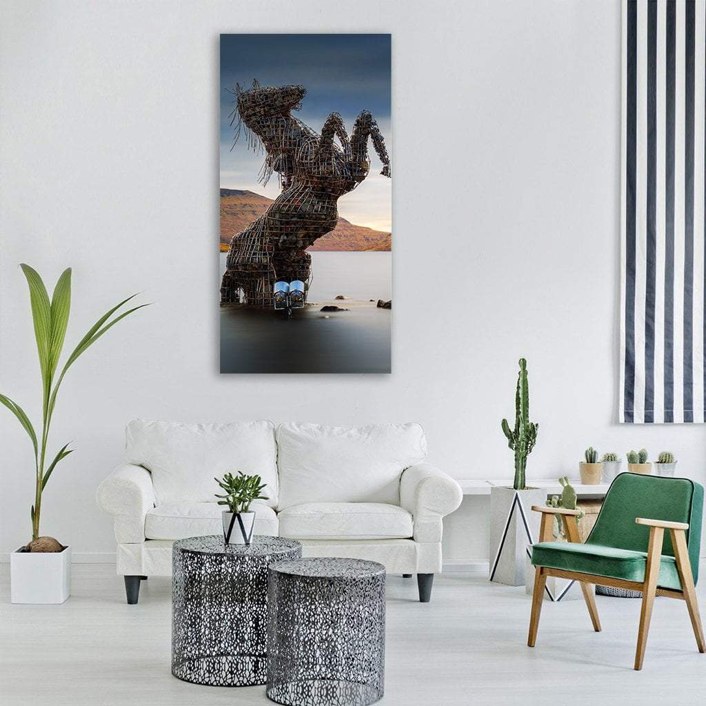 Nykur Horse Sculpture at Sorvagsvatn Lake Vertical Canvas Wall Art in gray, brown and blue, single vertical panel hung on a wall