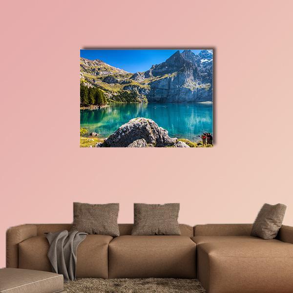 Oeschinen Mountain Lake Canvas Wall Art in gray, green and blue, single panel hung on a wall