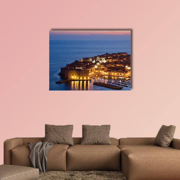 Historic Croatian Harbor at Twilight Canvas Wall Art in orange, yellow and blue, single panel hung on a wall