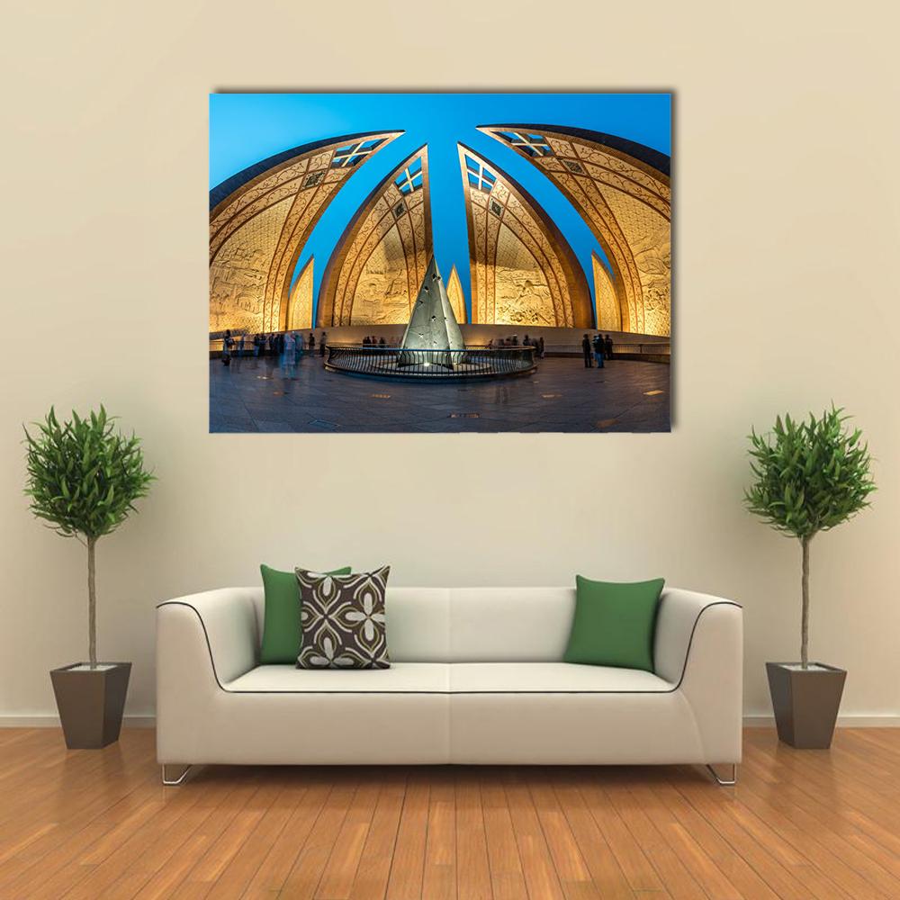 Illuminated Pakistan Monument at Night Canvas Wall Art in gold, yellow and blue, single panel hung on a wall