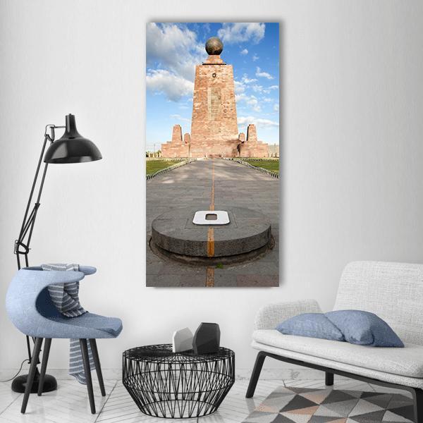 Mitad Del Mundo Monument in Ecuador Vertical Canvas Wall Art in gray, brown and blue, single vertical panel hung on a wall