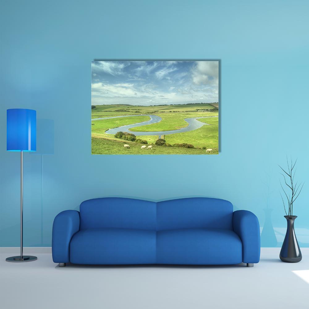 River Cuckmere with Sheep Canvas Wall Art in green and blue, single panel hung on a wall