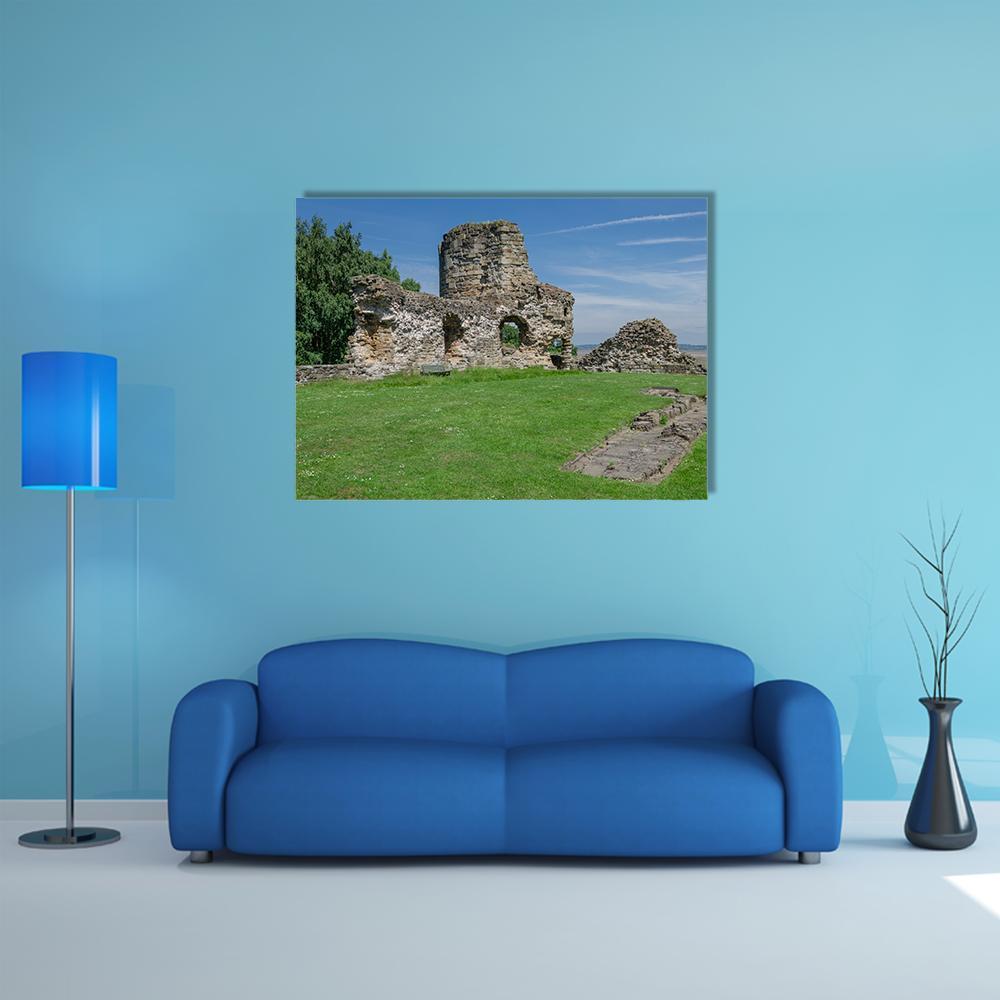 Ruins of Flint Castle Canvas Wall Art in brown, green and blue, single panel hung on a wall