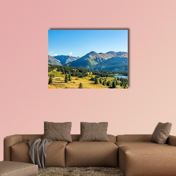 San Juan Sky Way Canvas Wall Art in yellow, green and blue, single panel hung on a wall