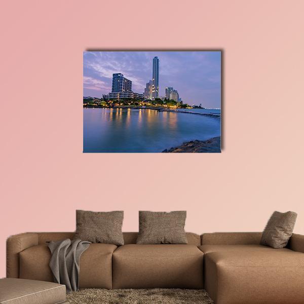 Twilight Seaside Town Skyline Canvas Wall Art in blue and purple, single panel hung on a wall