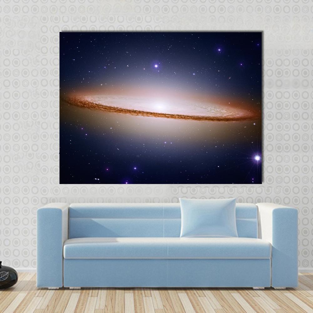 Sombrero Galaxy Canvas Wall Art in black, white and blue, single panel hung on a wall