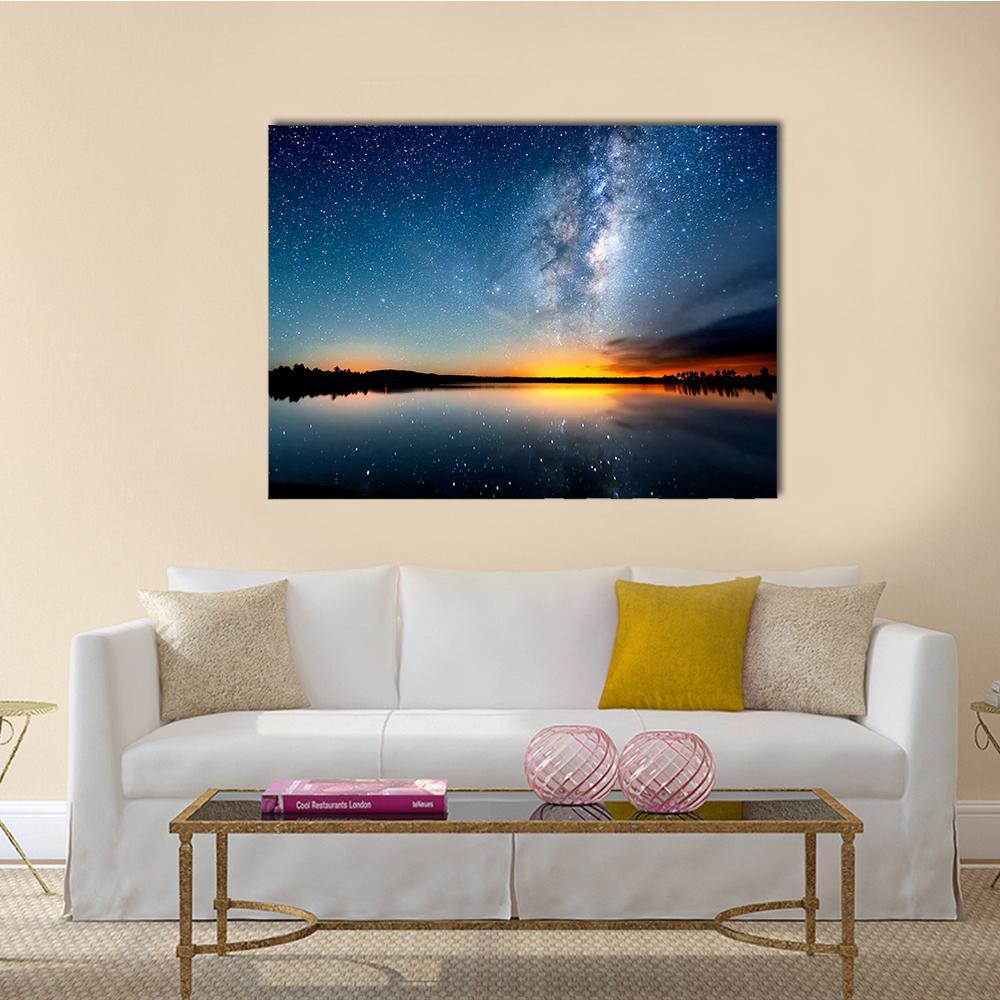 Milky Way Over Lake at Sunset Canvas Wall Art in black, orange and blue, single panel hung on a wall