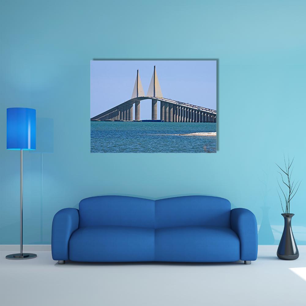 Sunshine Skyway Bridge with Yellow Cables Canvas Wall Art in gray and blue, single panel hung on a wall