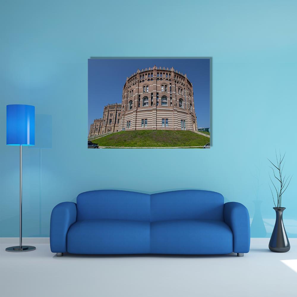 Vienna Gasometer Brick Facade Canvas Wall Art in brown, red and blue, single panel hung on a wall