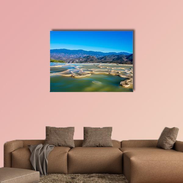 Oaxaca Terraced Thermal Pools Canvas Wall Art in beige, green and blue, single panel hung on a wall