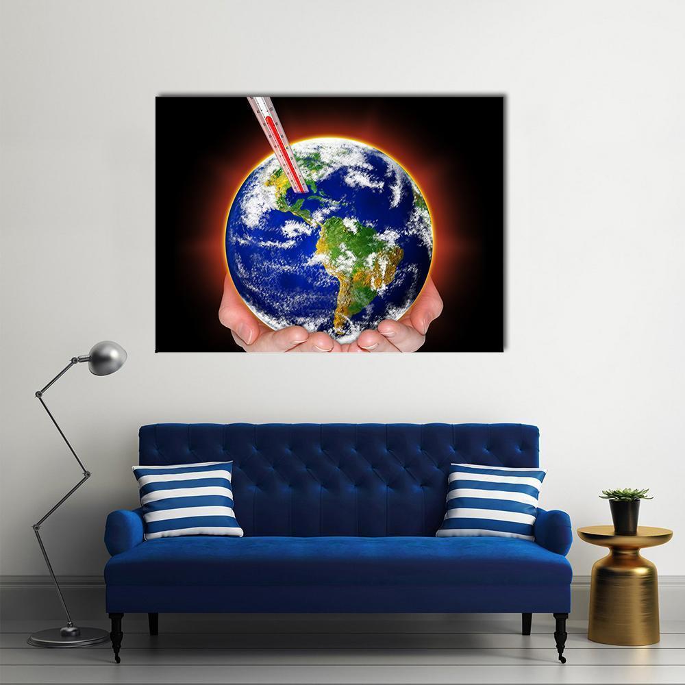Cupped Hands Holding Earth with Thermometer Canvas Wall Art in black, green and blue, single panel hung on a wall