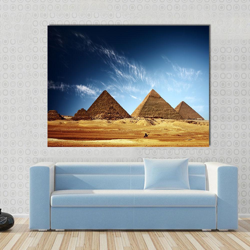 Giza Valley with Great Pyramids Canvas Wall Art in beige, brown and blue, single panel hung on a wall