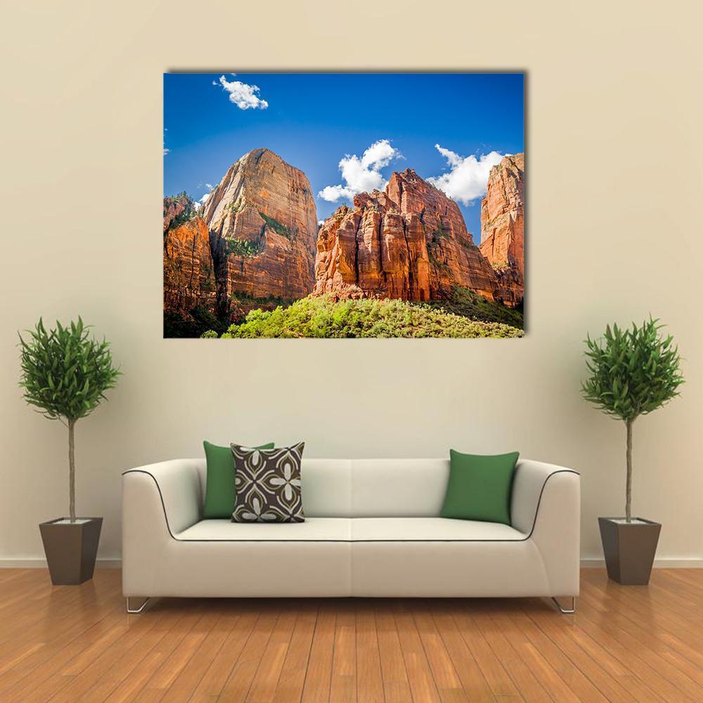 Three Patriarchs Zion National Park Canvas Wall Art in brown, orange and blue, single panel hung on a wall