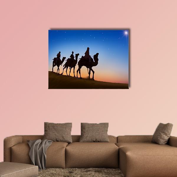 Three Wise Men in the Desert Canvas Wall Art in black, orange and blue, single panel hung on a wall