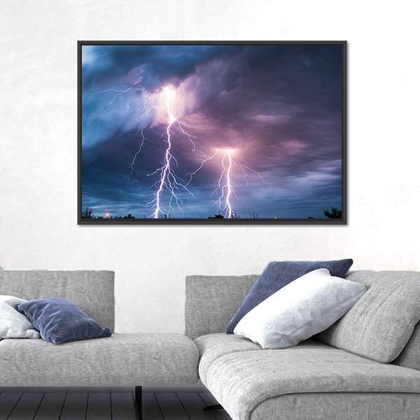 Dramatic Lightning Strike Over Dark Clouds Canvas Wall Art in black, blue and purple, framed canvas, product view on a white background