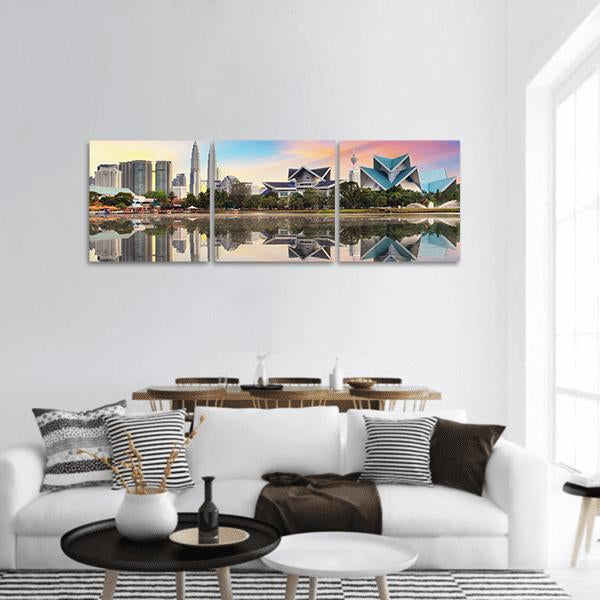 Malaysia Skyline with Petronas Twin Towers Panoramic Canvas Wall Art in gray, blue and pink, hung on a wall