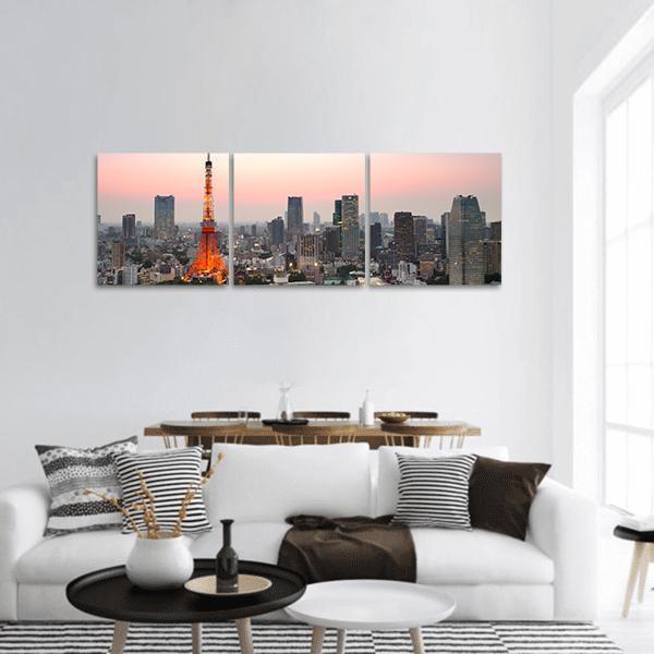Tokyo Skyline at Dusk Panoramic Canvas Wall Art in gray, orange and pink, hung on a wall
