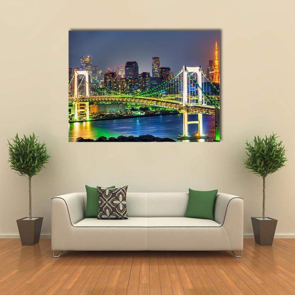 Illuminated Rainbow Bridge Over Tokyo Skyline Canvas Wall Art in green, blue and multicolor, single panel hung on a wall