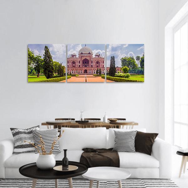 Humayun's Tomb in Mughal Charbagh Garden Panoramic Canvas Wall Art in red, green and blue, hung on a wall