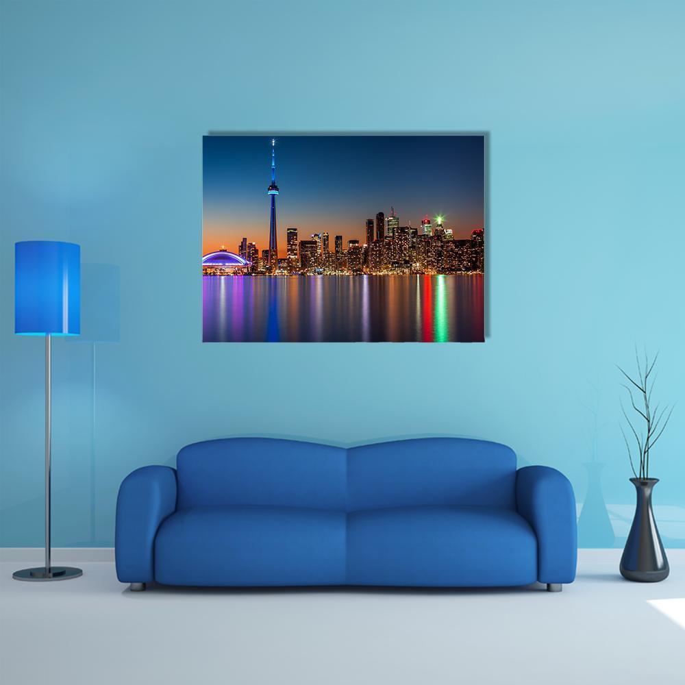 Toronto Skyline at Dusk Canvas Wall Art in black, orange and blue, single panel hung on a wall