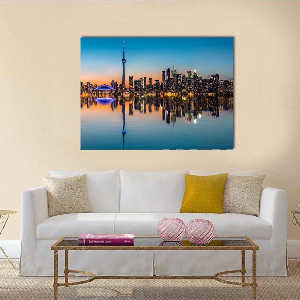 Toronto Skyline at Dusk Canvas Wall Art in black, orange and blue, single panel hung on a wall