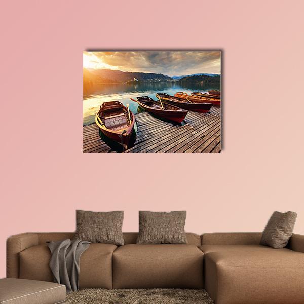 Rowboats on Lake Bled Canvas Wall Art in brown, orange and blue, single panel hung on a wall