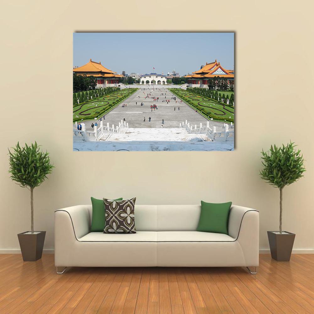 Tourists at Liberty Square Canvas Wall Art in gray, green and blue, single panel hung on a wall