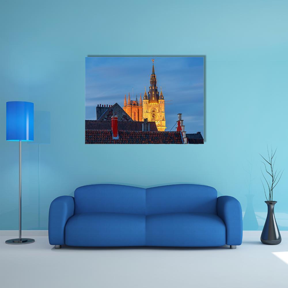 Gothic Cathedral Tower at Golden Dusk Canvas Wall Art in gold, orange and blue, single panel hung on a wall