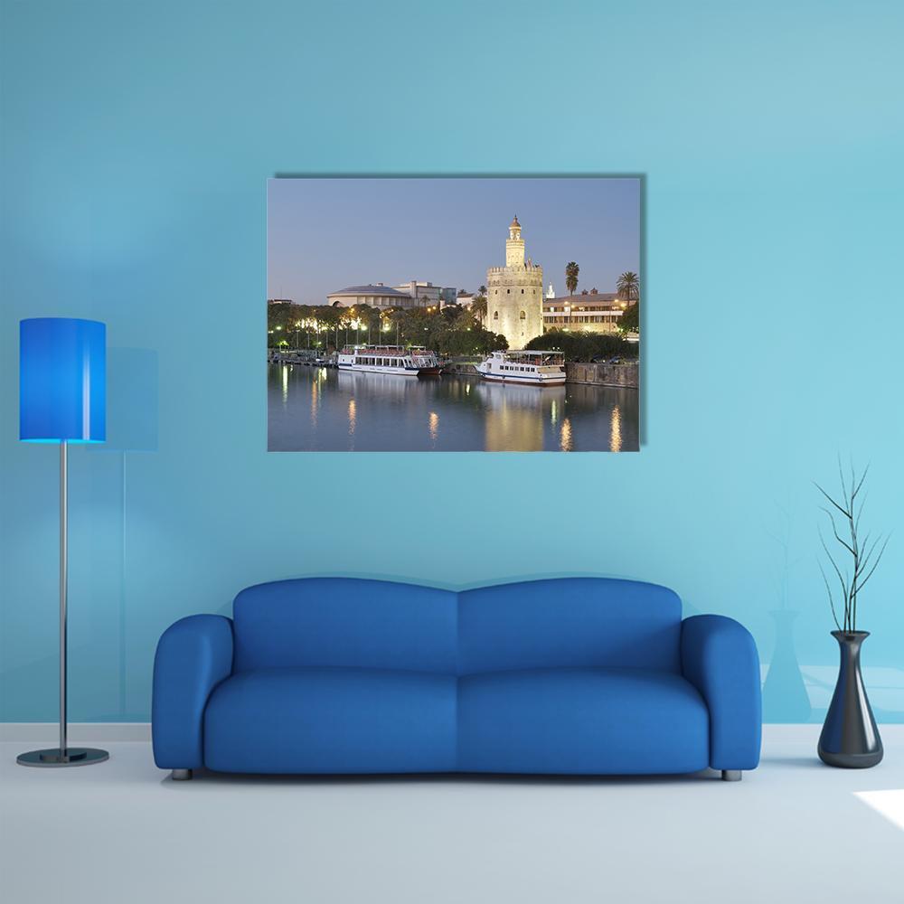 Torre Del Oro on Guadalquivir River Canvas Wall Art in gold, yellow and blue, single panel hung on a wall