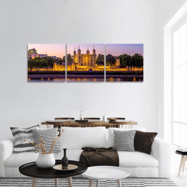 Tower of London at Dusk Panoramic Canvas Wall Art in yellow, blue and purple, hung on a wall