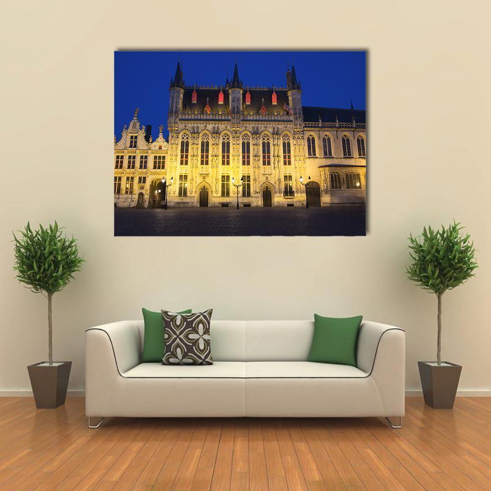 Bruges Town Hall at Night Canvas Wall Art in gold, yellow and blue, single panel hung on a wall