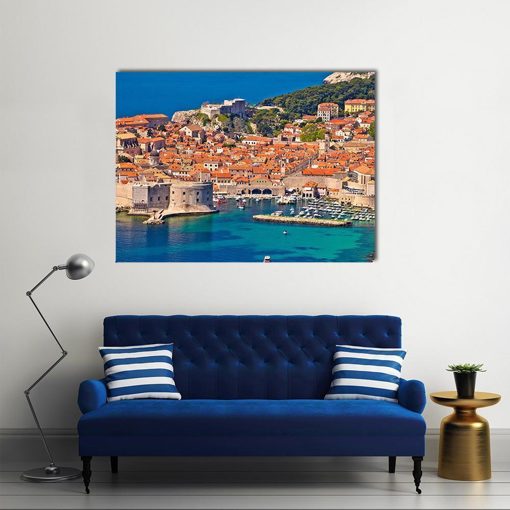 Dubrovnik Harbor View with Red-tiled Roofs Canvas Wall Art in red, orange and blue, single panel hung on a wall