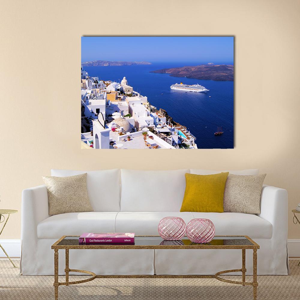 Fira, Santorini Coastal Townscape Canvas Wall Art in white and blue, single panel hung on a wall