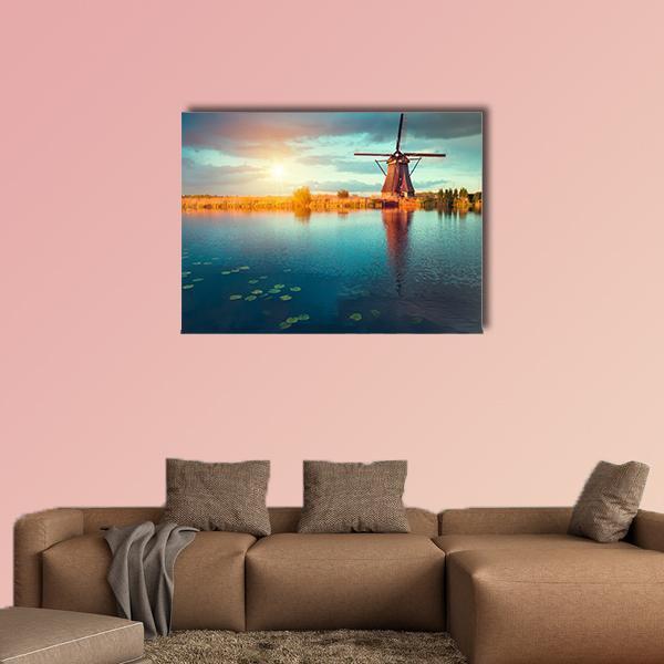 Traditional Dutch Windmills Canvas Wall Art in orange, yellow and blue, single panel hung on a wall