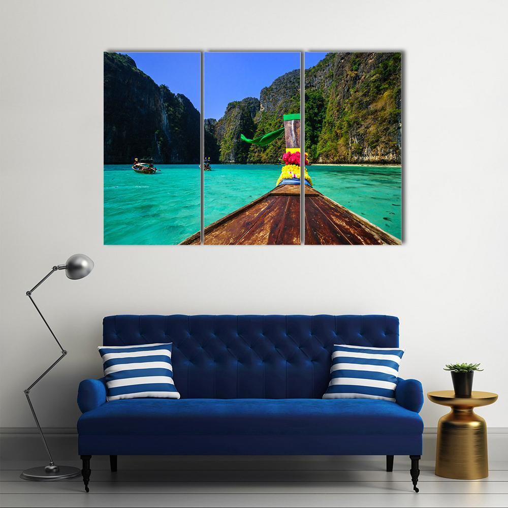 Traditional Longtail Boat in Pile Bay Canvas Wall Art in brown, green and blue, 3 panel horizontal set hung on a wall