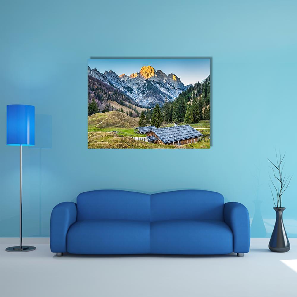 Traditional Mountain Chalets Canvas Wall Art in gray, green and blue, single panel hung on a wall
